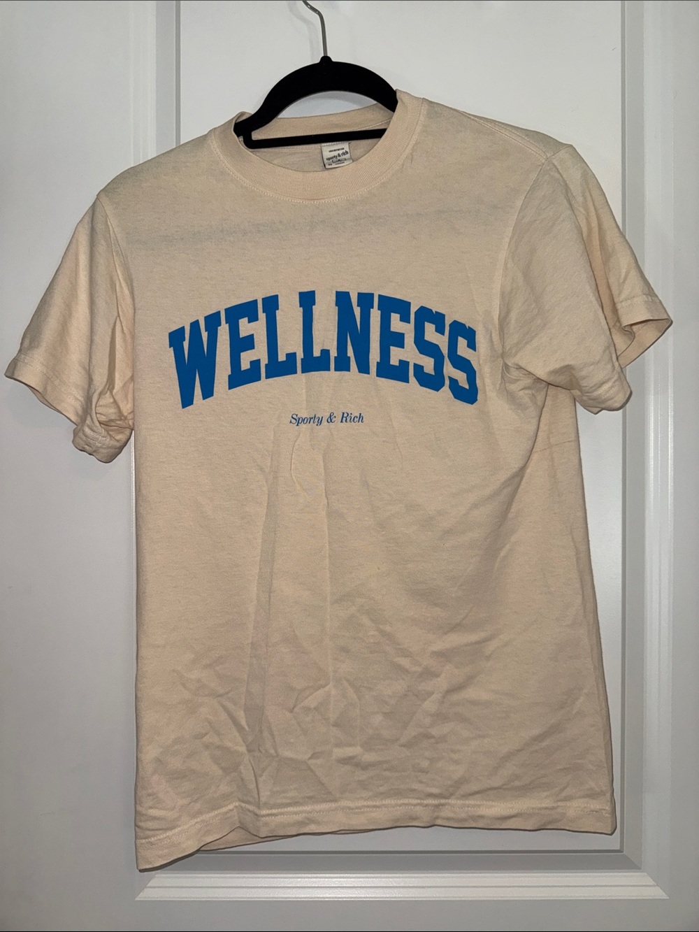 Sporty & Rich Wellness Graphic Tee - Cream with Blue Logo Small